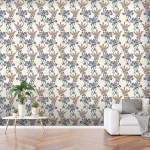 Wild heather wallpaper design represented on a living room wall along with a white sofa and table with green plants on. 