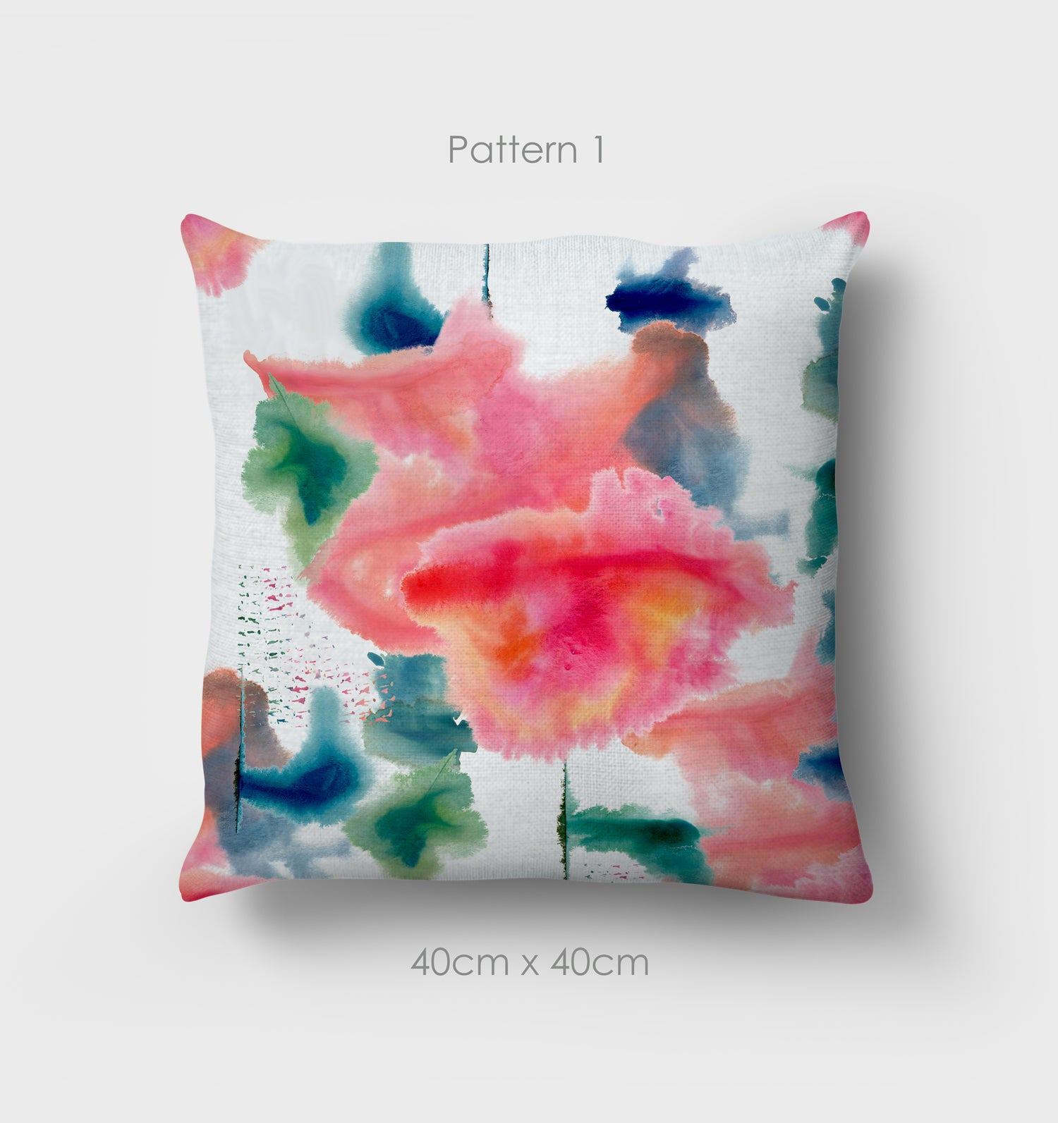 Spring Falls cushion, 40cm, pattern1, the pink cloud like pattern is the central focus of the cushion. Hand painted water colour design. Green and blue colours adorn the rim of the cushion.