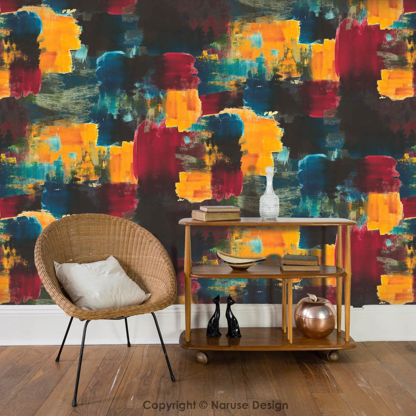 Bright and colourful wallpaper design set in a living room with a chair and table with ornaments. Wallpaper colours are a blend of bright yellow, forest green, bold teal and cyber red.